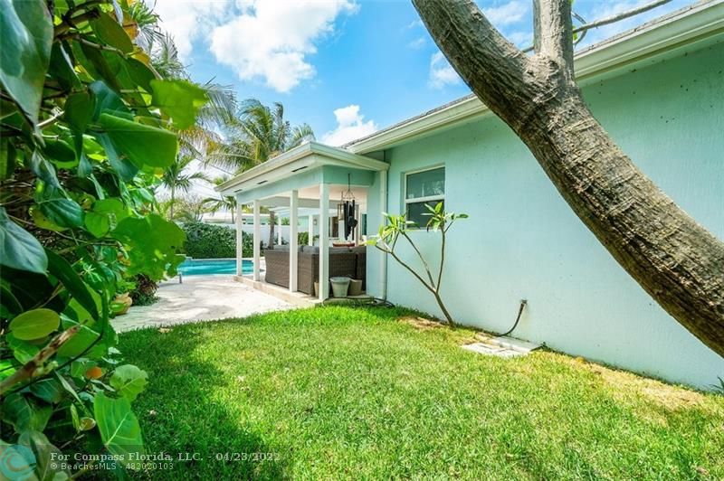 2932 Northeast 36th Street Lighthouse Point, FL 33064 - Photo 25 of 31 a view of a backyard with a garden