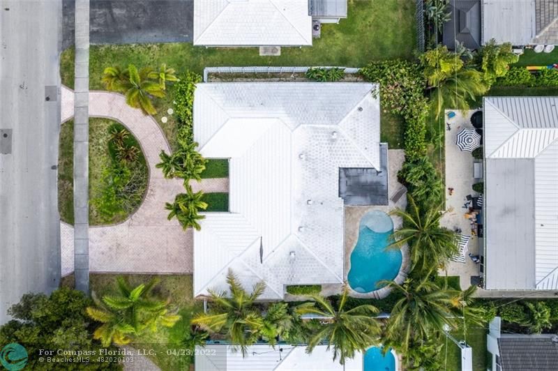 2932 Northeast 36th Street Lighthouse Point, FL 33064 - Photo 26 of 31 an aerial view of a house with a yard and a garden
