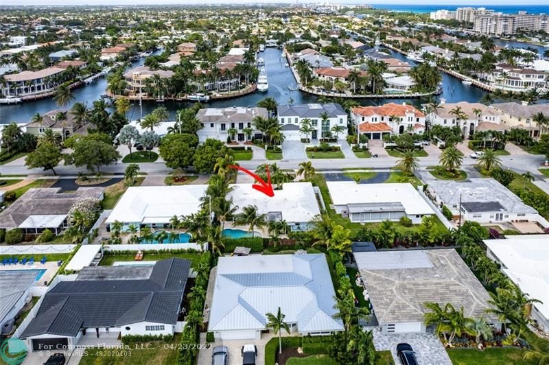 2932 Northeast 36th Street Lighthouse Point, FL 33064 - Photo 27 of 31 an aerial view of residential houses with outdoor space and swimming pool