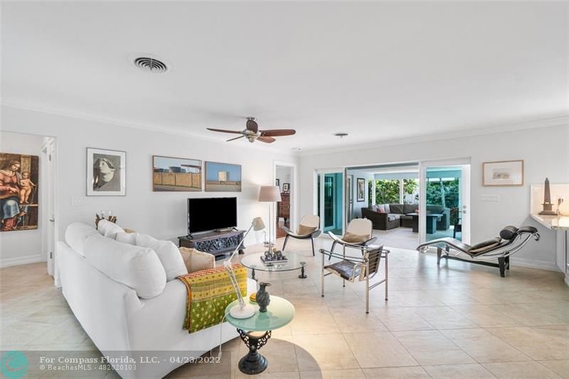 2932 Northeast 36th Street Lighthouse Point, FL 33064 - Photo 3 of 31 a living room with fireplace furniture and a flat screen tv