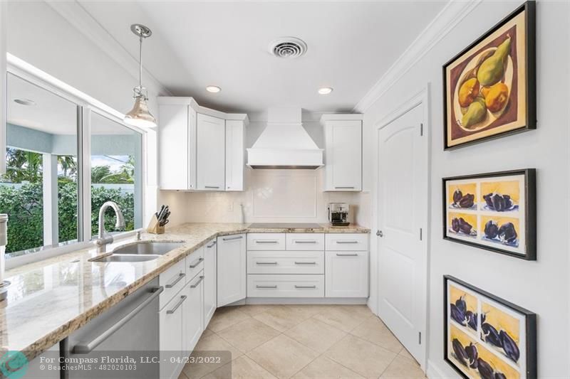 2932 Northeast 36th Street Lighthouse Point, FL 33064 - Photo 6 of 31 a large kitchen with stainless steel appliances granite countertop a stove a sink and a refrigerator
