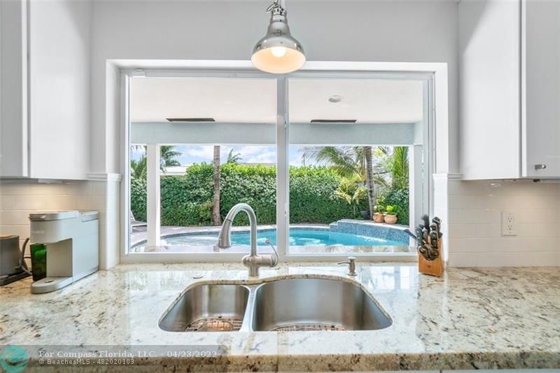 2932 Northeast 36th Street Lighthouse Point, FL 33064 - Photo 7 of 31 a kitchen with a sink and a large window