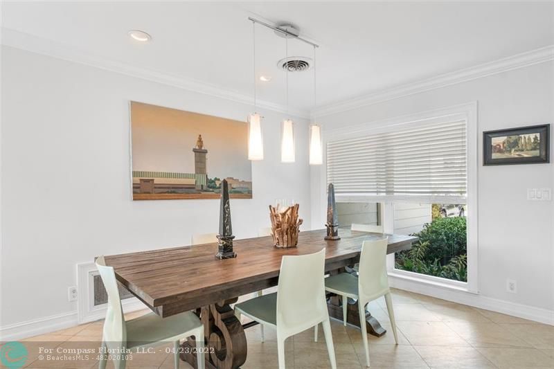 2932 Northeast 36th Street Lighthouse Point, FL 33064 - Photo 9 of 31 a view of a dining room with furniture and wooden floor