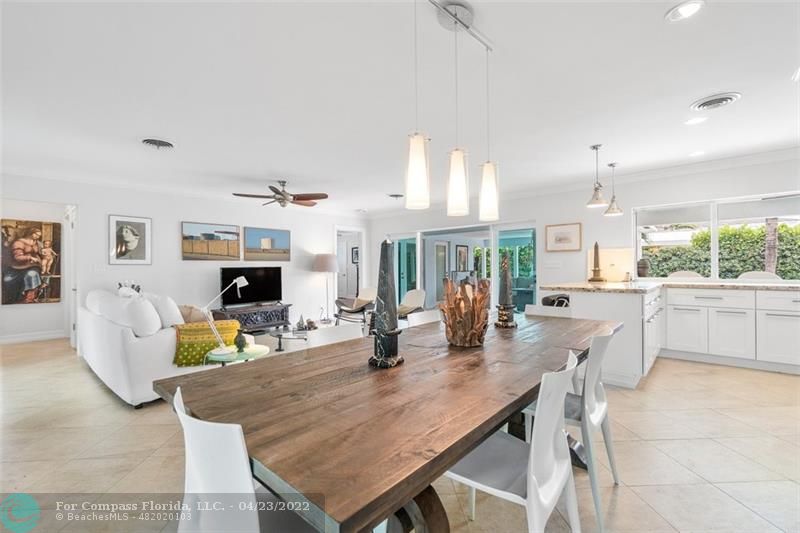 2932 Northeast 36th Street Lighthouse Point, FL 33064 - Photo 10 of 31 a dining room with furniture and a fireplace