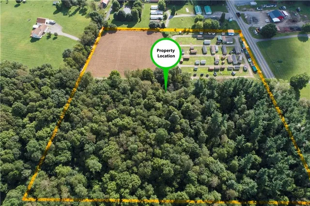 a aerial view of a golf course with a lake view