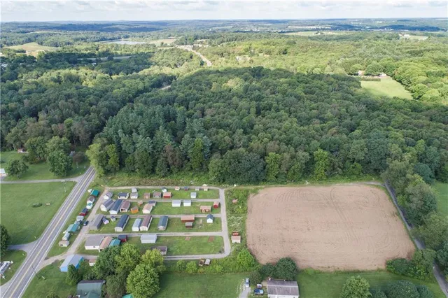 a view of a wooden fence front of house