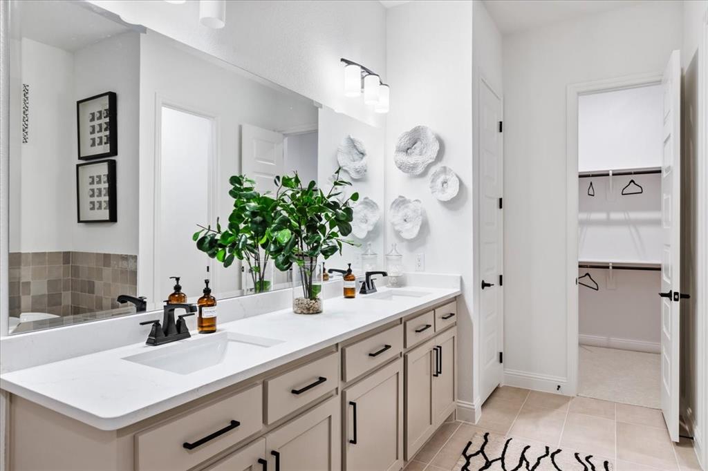 1210 Terrain Road Midlothian, TX 76065 - Photo 17 of 39 a bathroom with a double vanity sink a mirror and a shower