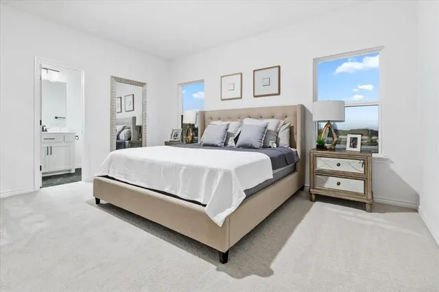 a bedroom with a bed and a night stand