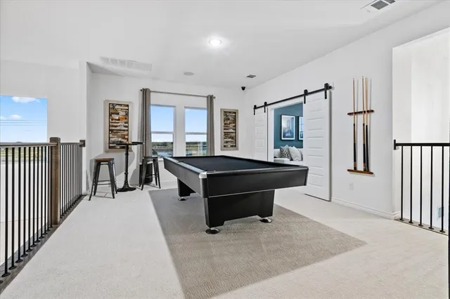 a living room with furniture a table and a window