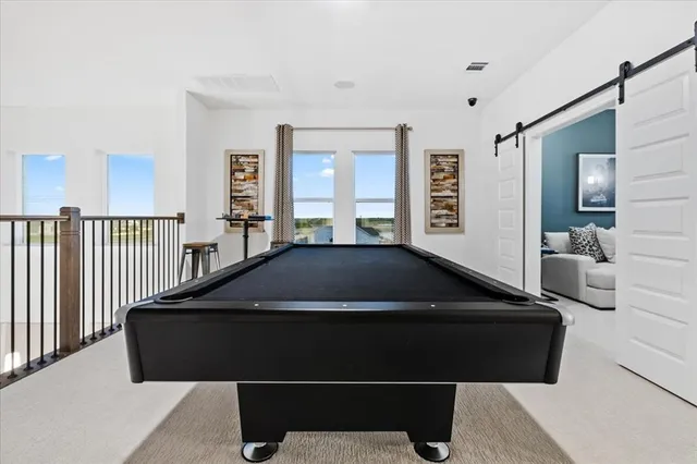 a living room with a large bed and a large window