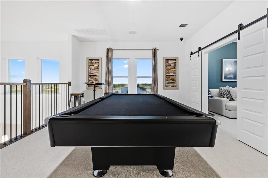 1210 Terrain Road Midlothian, TX 76065 - Photo 25 of 39 a living room with a large bed and a large window