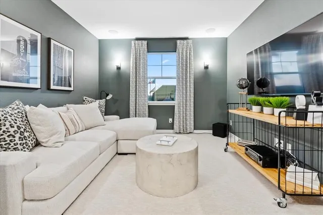 a living room with furniture and a table