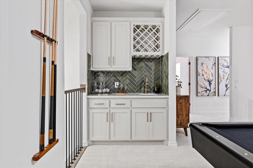 1210 Terrain Road Midlothian, TX 76065 - Photo 28 of 39 a kitchen with white cabinets and a stove