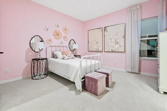 a bed room with a bed and a window