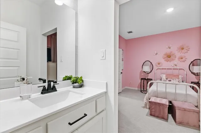 a bathroom with a sink a large mirror and a shower