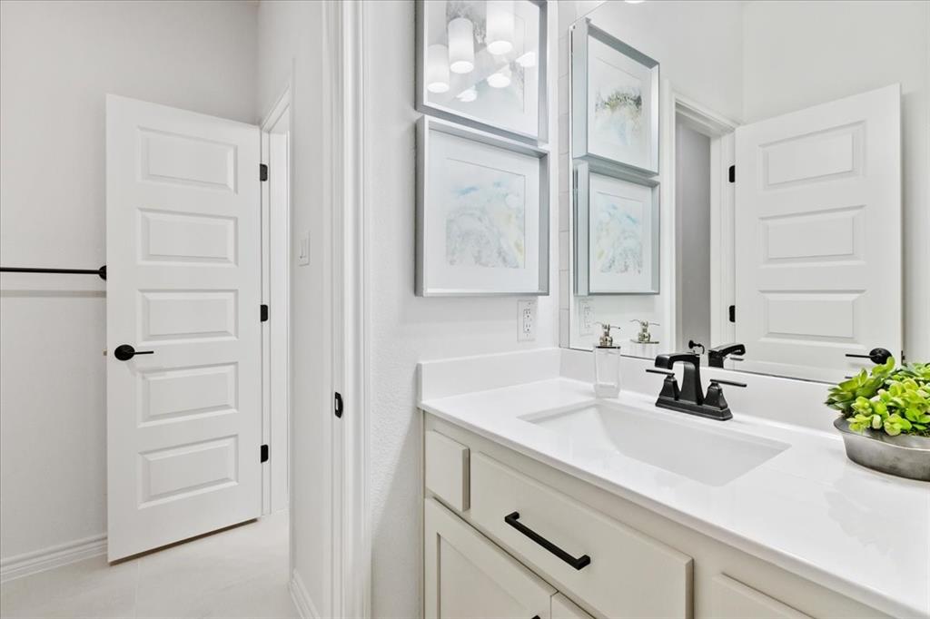 1210 Terrain Road Midlothian, TX 76065 - Photo 33 of 39 a bathroom with a sink and a mirror