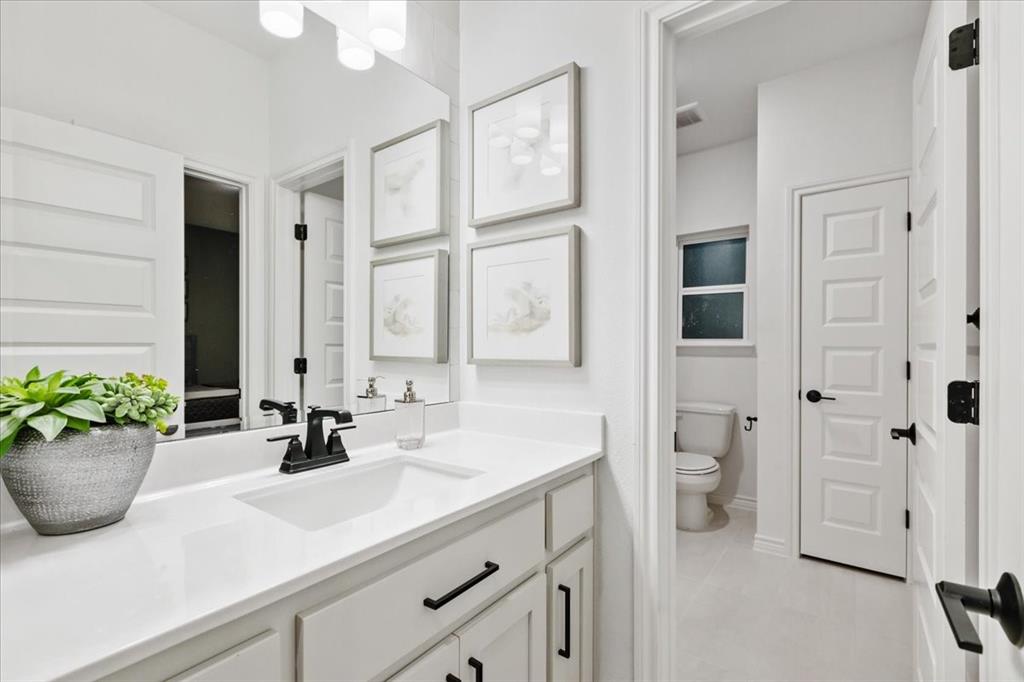 1210 Terrain Road Midlothian, TX 76065 - Photo 34 of 39 a bathroom with a sink a toilet and shower