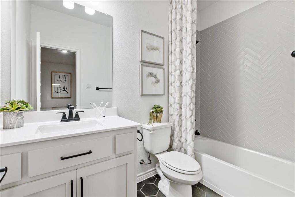 1210 Terrain Road Midlothian, TX 76065 - Photo 37 of 39 a bathroom with a sink a toilet and shower
