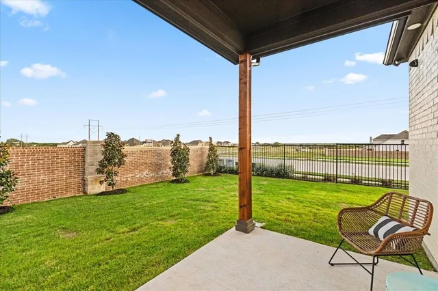 a view of a chair and table in the garden