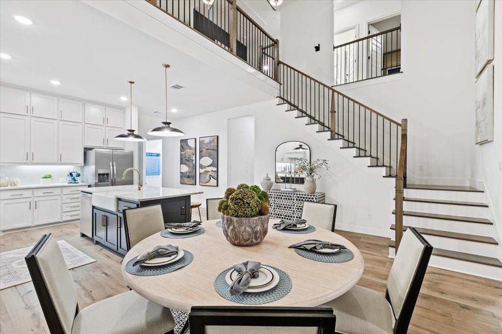 1210 Terrain Road Midlothian, TX 76065 - Photo 9 of 39 a view of a dining room with furniture and wooden floor