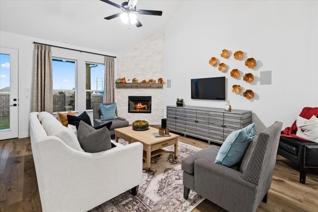 1210 Terrain Road Midlothian, TX 76065 - Photo 10 of 39 a living room with furniture and a fireplace