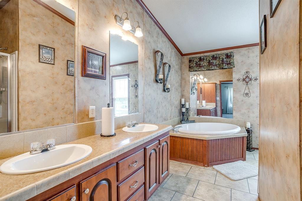 321 Young Road Millsap, TX 76066 - Photo 17 of 28 a bathroom with a double vanity sink mirror and double