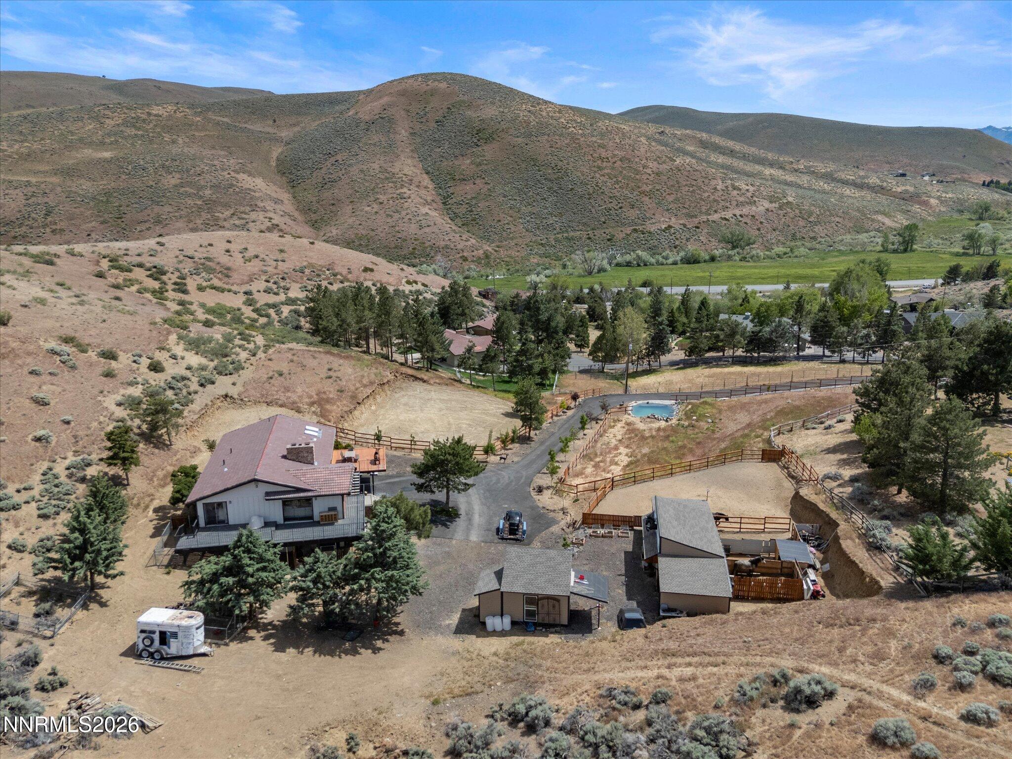 20449 Temelec Way Reno, NV 89521 - Photo 2 of 65 an aerial view of a house with a mountain