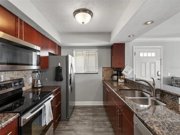 a bathroom with a sink toilet and mirror