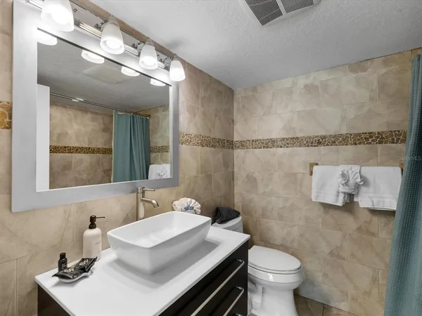 a bed room with a bed and a table