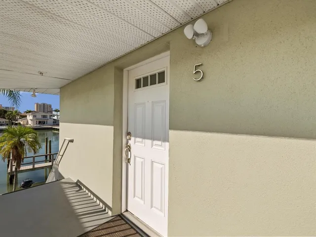 a view of washer and dryer with kitchen in the background