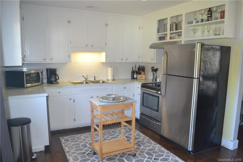 3233 Smith Farm Road Matthews, NC 28104 - Photo 2 of 23 a kitchen with a refrigerator sink and stove