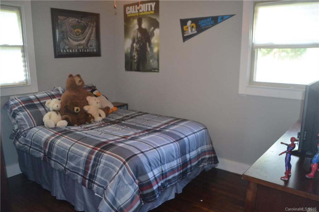 3233 Smith Farm Road Matthews, NC 28104 - Photo 11 of 23 a bed sitting in a bedroom next to a window