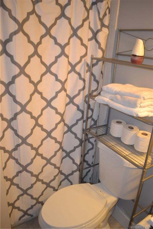 3233 Smith Farm Road Matthews, NC 28104 - Photo 12 of 23 a bathroom with a granite countertop toilet and a sink