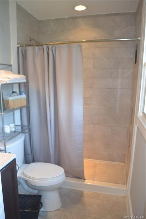 3233 Smith Farm Road Matthews, NC 28104 - Photo 14 of 23 a bathroom with a shower a toilet and a sink