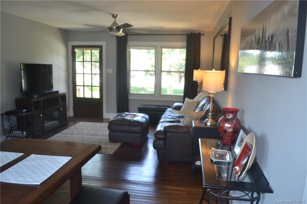 3233 Smith Farm Road Matthews, NC 28104 - Photo 5 of 23 a living room with furniture and a flat screen tv