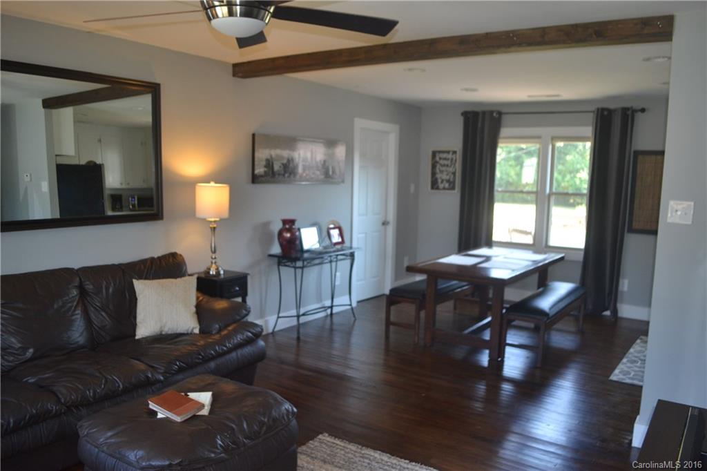 3233 Smith Farm Road Matthews, NC 28104 - Photo 6 of 23 a living room with furniture and wooden floor