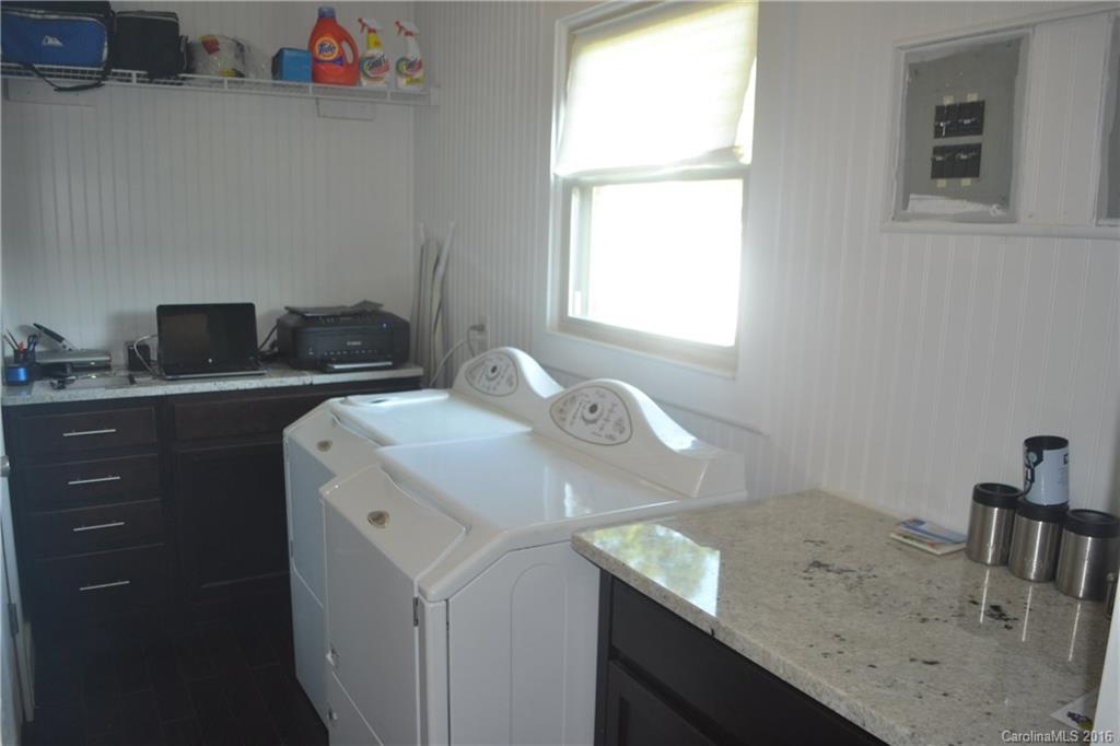 3233 Smith Farm Road Matthews, NC 28104 - Photo 8 of 23 a utility room with a sink dryer and washer