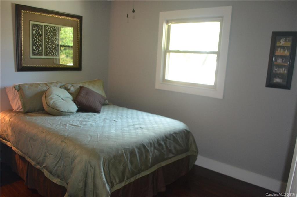 3233 Smith Farm Road Matthews, NC 28104 - Photo 10 of 23 a bedroom with a bed and a window