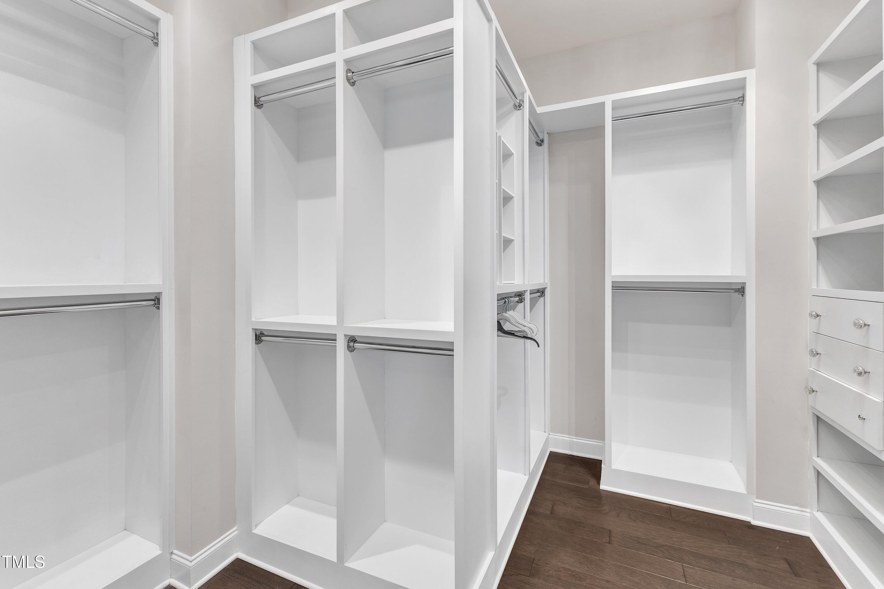 8121 Greys Landing Way Raleigh, NC 27615 - Photo 35 of 95 a view of walk in closet with empty racks