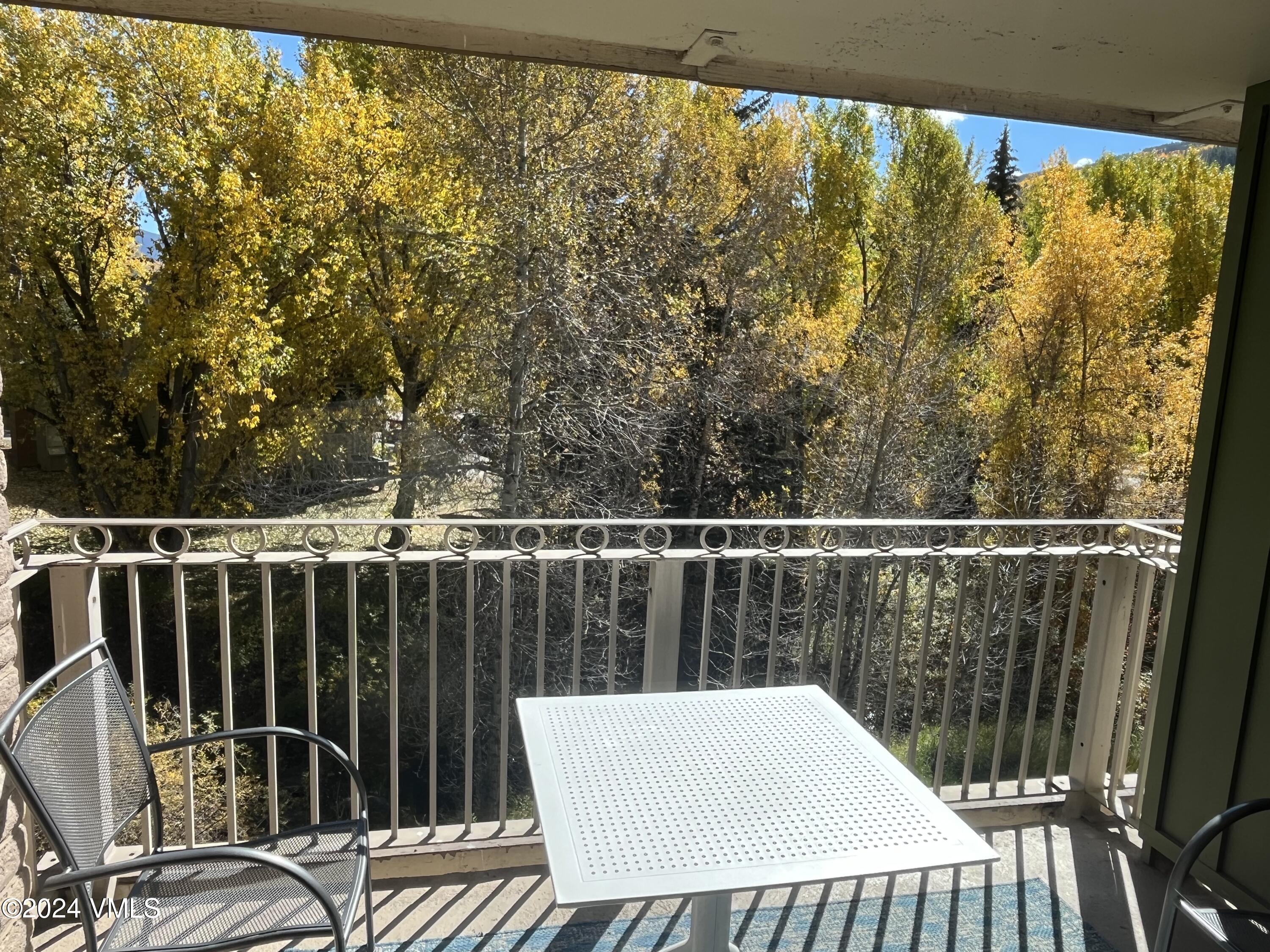 1020 Vail View Drive, Unit 230833 Vail, CO 81657 - Photo 16 of 20 a view of a balcony with wooden floor
