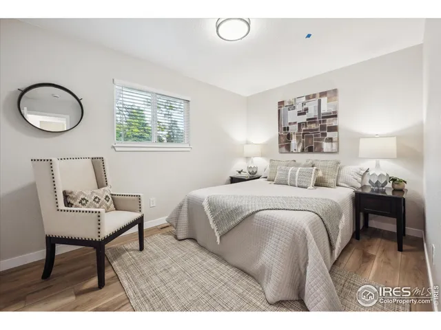 a bedroom with a bed and a table