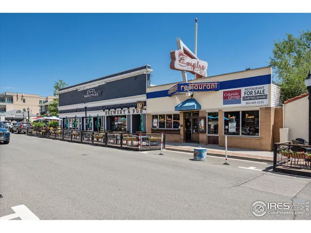 a view of a street with sitting area