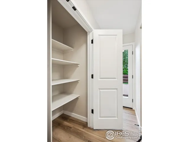 a view of a hallway with closet