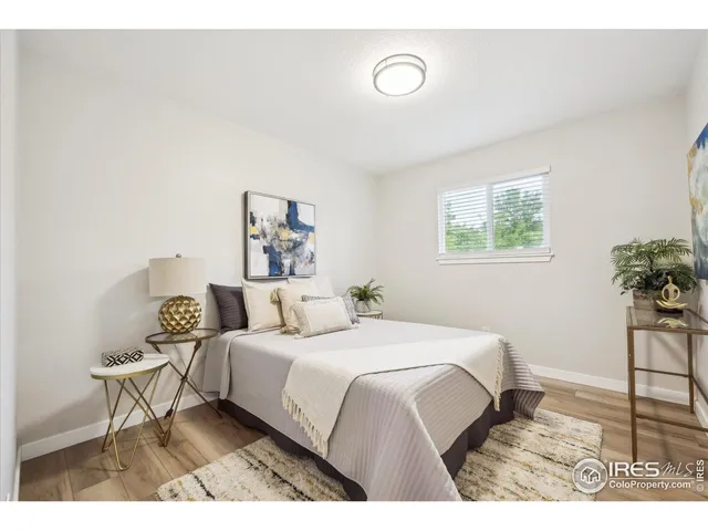 a bedroom with a bed and a table