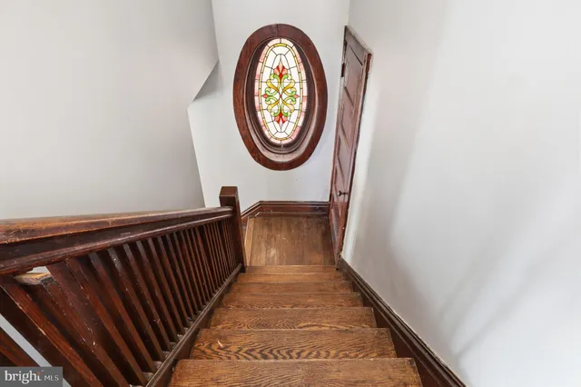 a kitchen with a refrigerator sink stove and cabinets