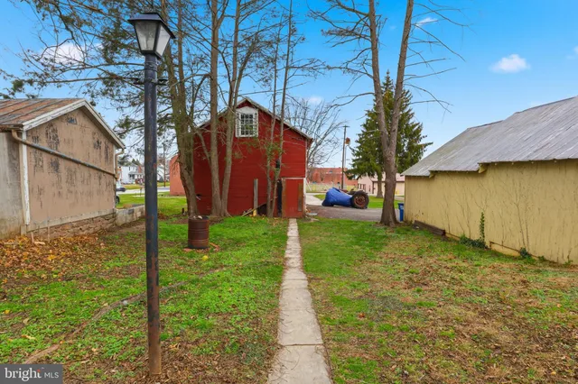 an aerial view of a city with lots of residential buildings and ocean view