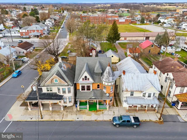 an aerial view of a house with a ocean view
