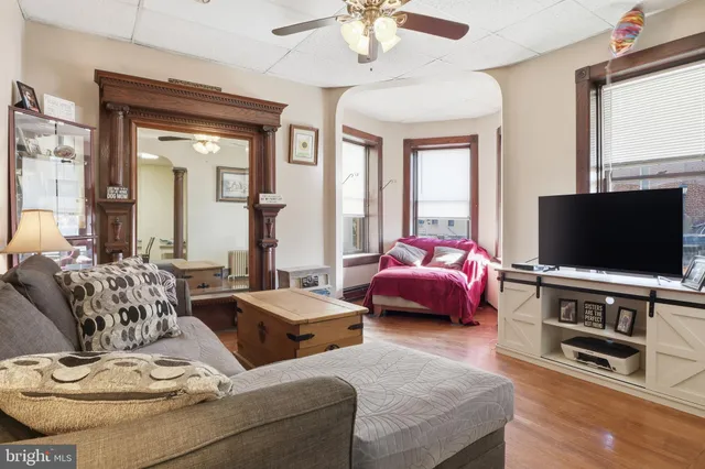 a bathroom with a sink and mirror with toilet