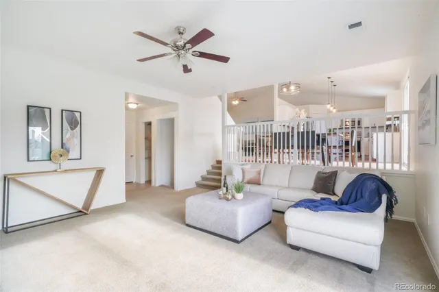 a living room with furniture and a rug