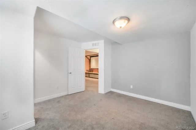 a bathroom with a sink toilet and a mirror